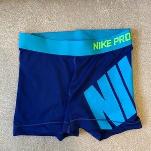 Womens small nike pro shorts, blue with neon green symbol